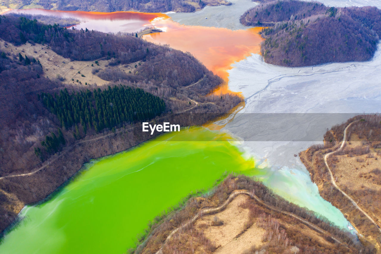 Aerial view of copper waste in lake amidst mountains