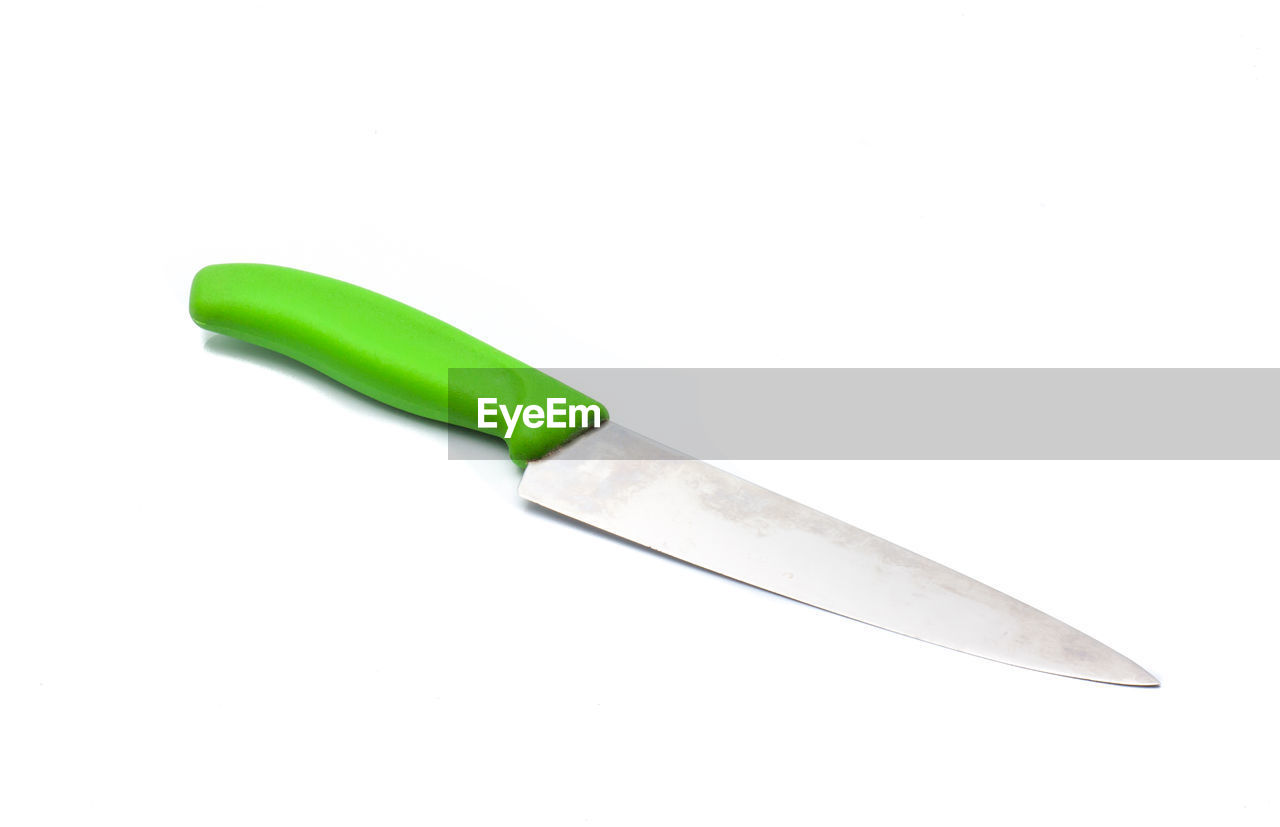 High angle view of green knife on white background