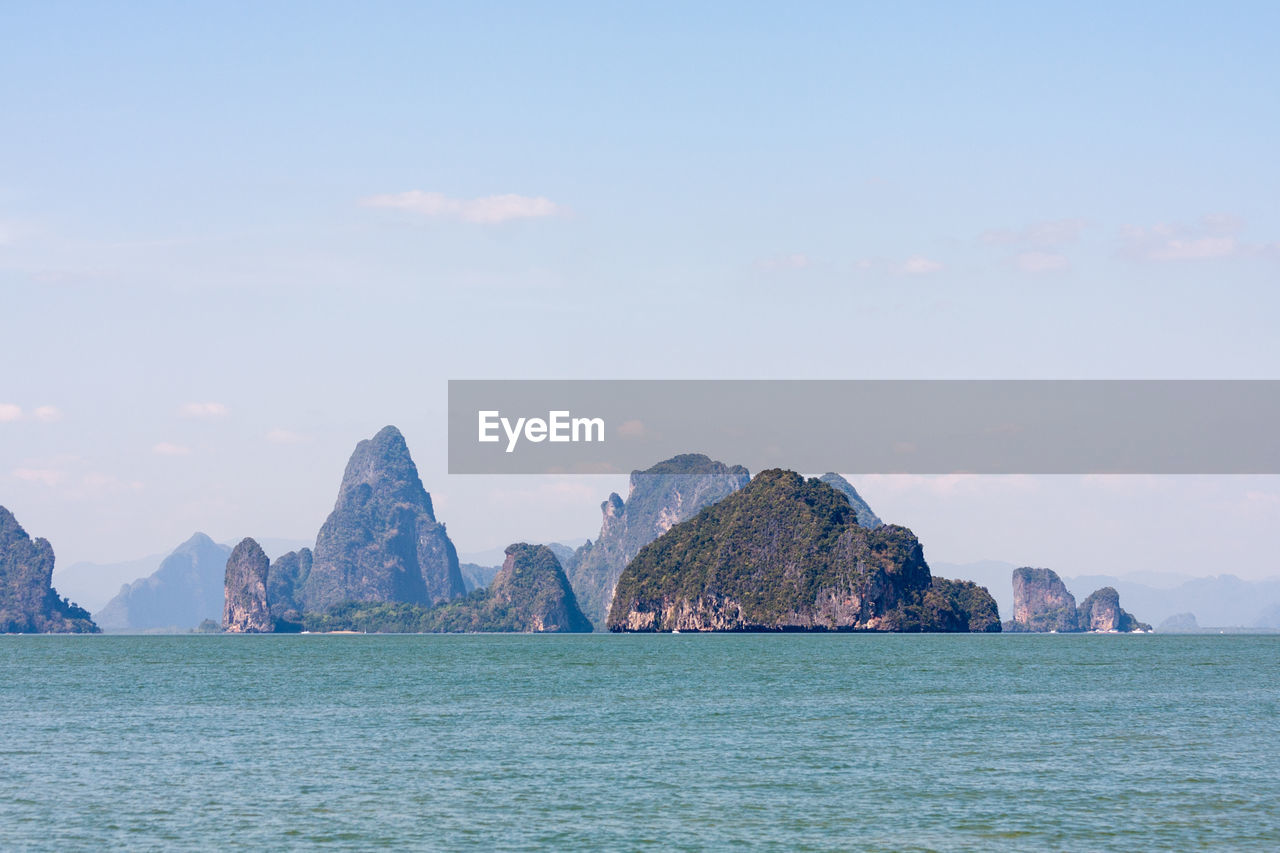 Panoramic view of sea and rocks against sky