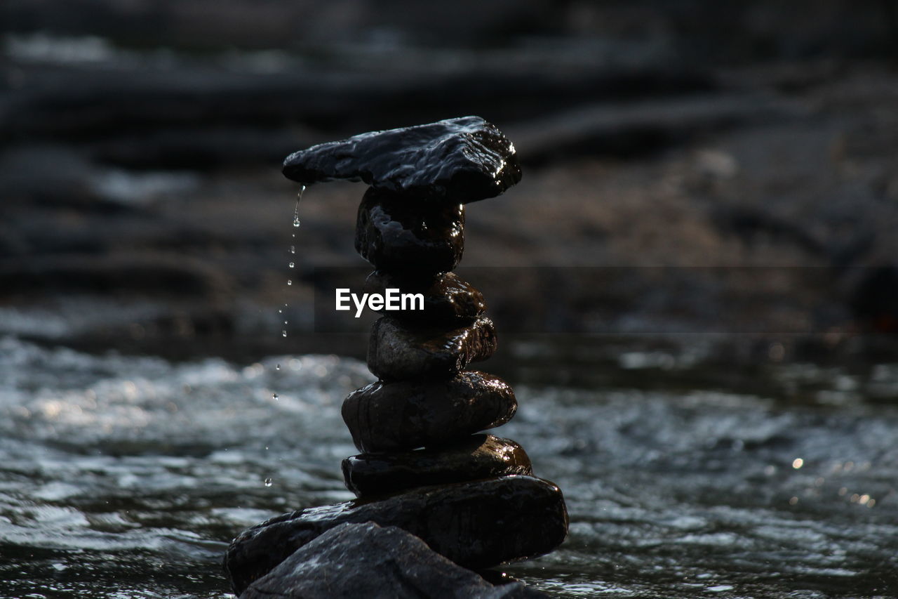 Close-up of pebbles on rock