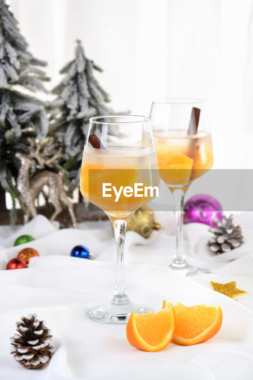 Light christmas spritzer made with orange juice and vodka. the cocktail to start your holiday party