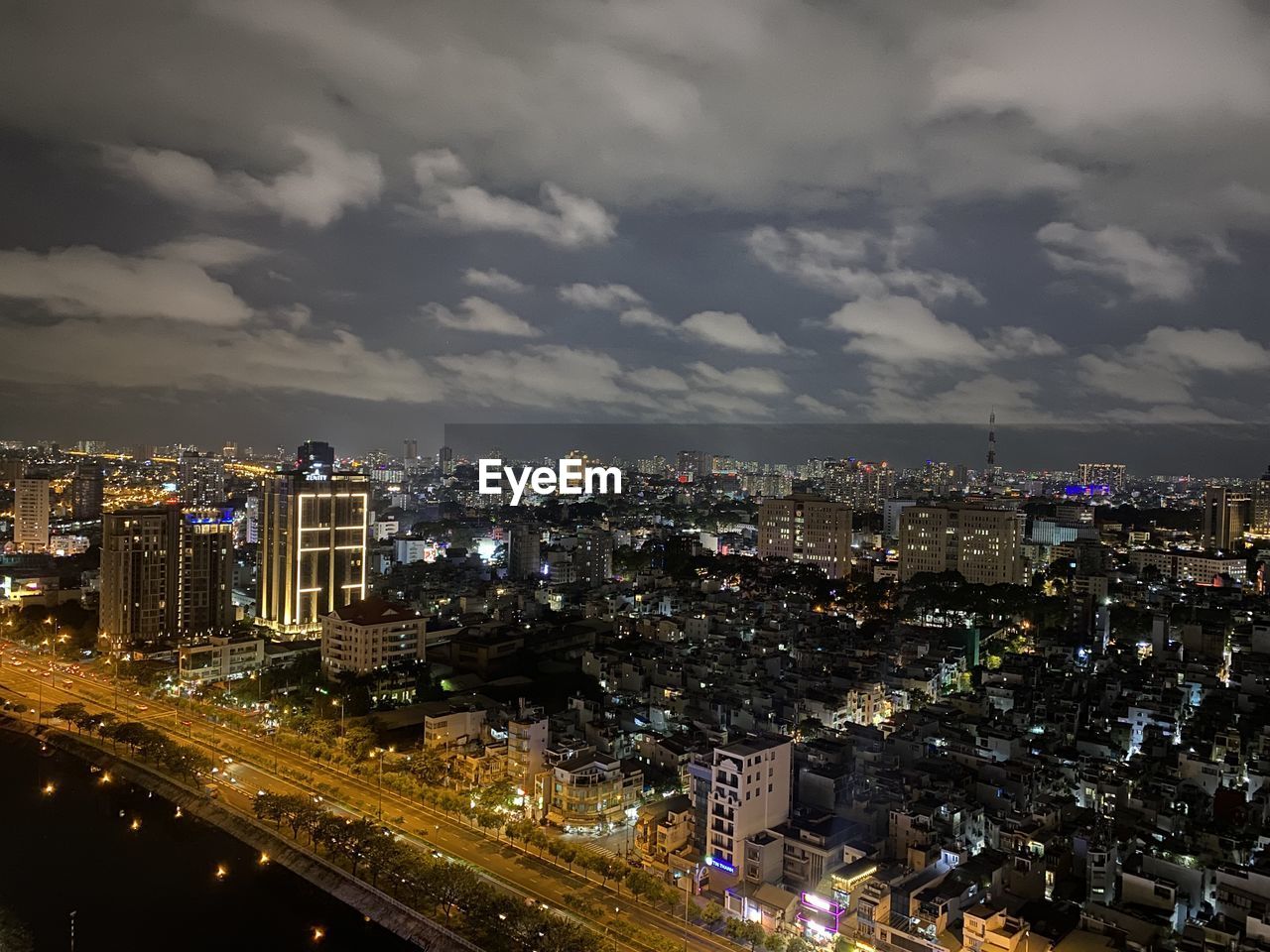 high angle view of illuminated buildings against sky at night