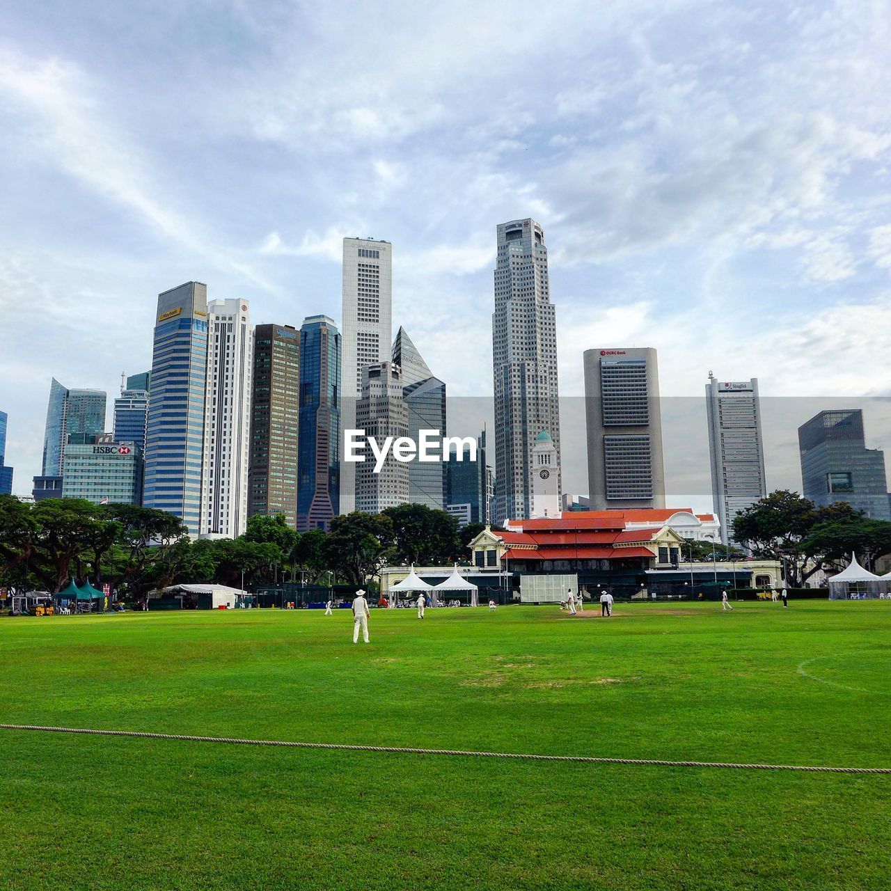 View of skyscrapers against cloudy sky