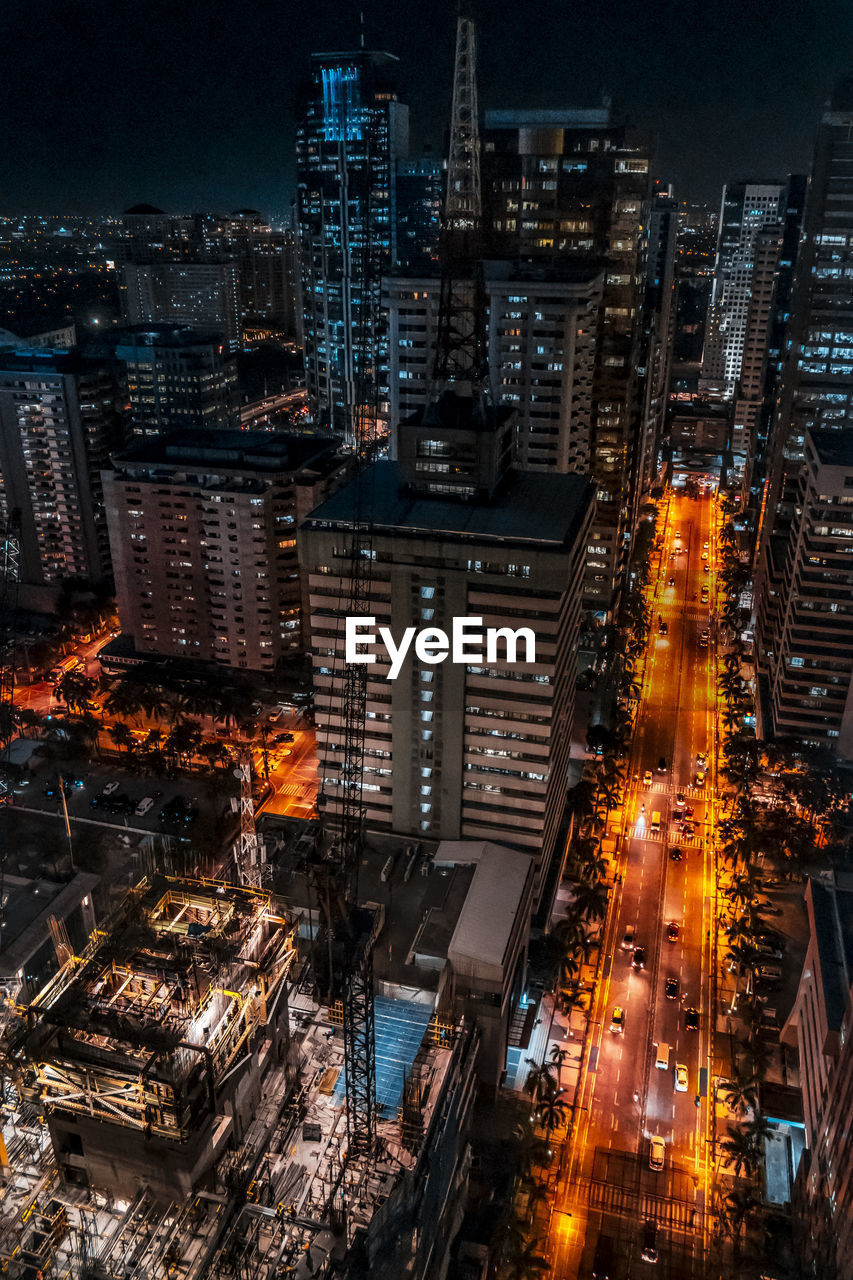 Aerial view of city lit up at night