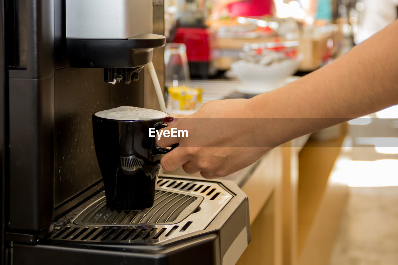 MIDSECTION OF MAN WORKING IN COFFEE