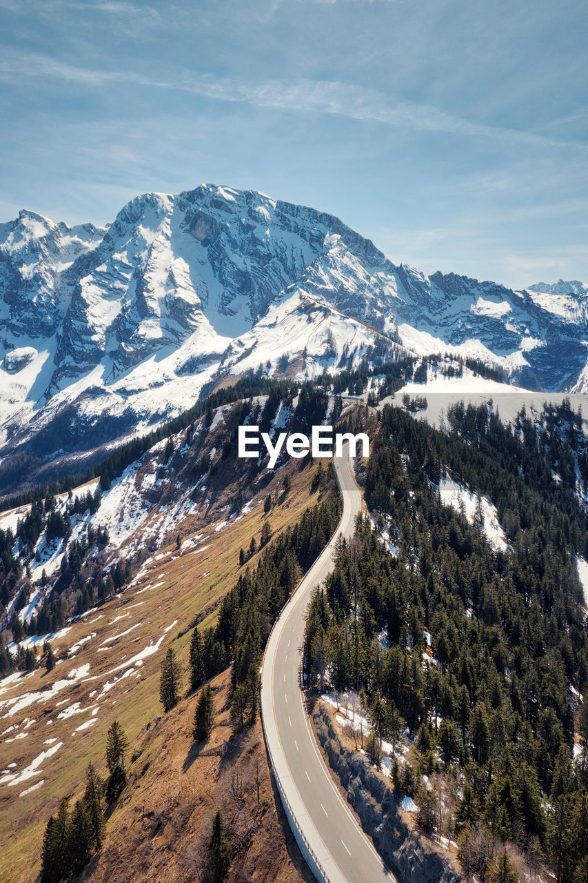 High angle view of snowcapped mountains against sky