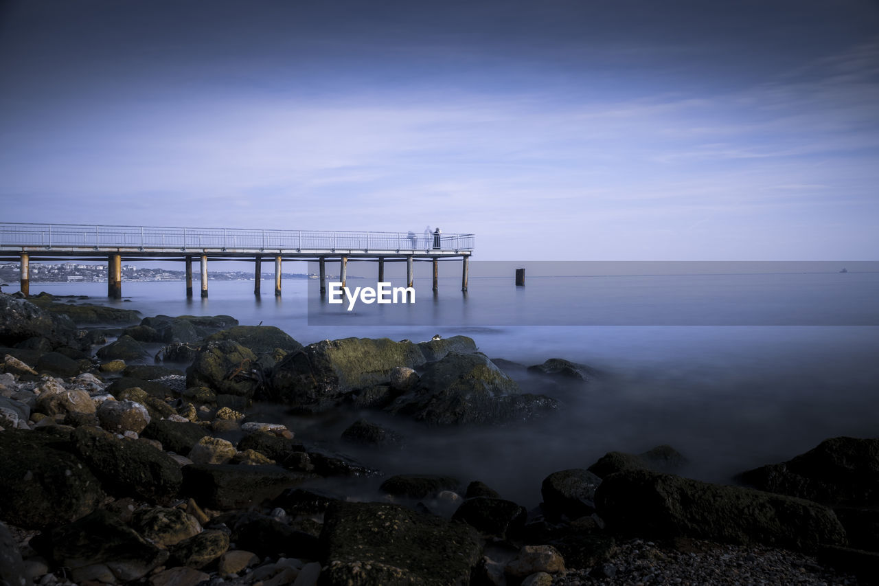 Scenic view of bay against sky