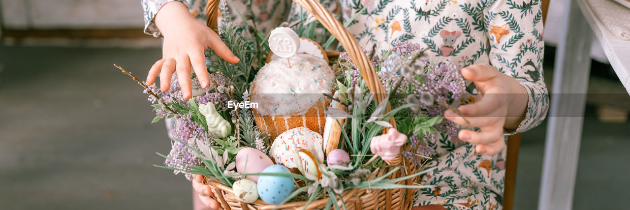 spring, floristry, flower, floral design, one person, plant, adult, women, nature, midsection, flowering plant, hand, holding, focus on foreground, day, freshness, outdoors, bouquet, lifestyles, celebration, close-up, fashion, wedding dress, art, dress, bride, flower arrangement, standing, food, tradition