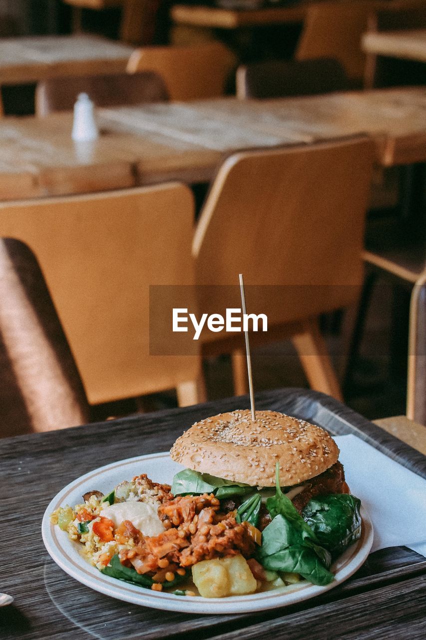 Close-up of food served on wooden table in restaurant