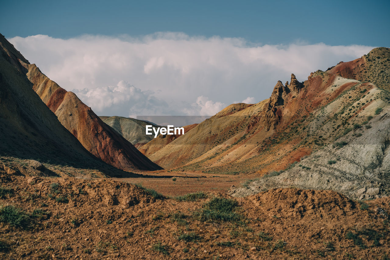 Panoramic view of rocky mountains against sky