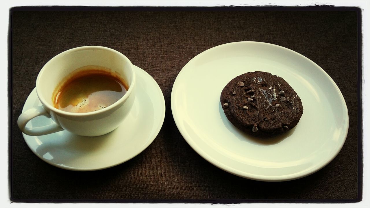 Cookie and coffee on table