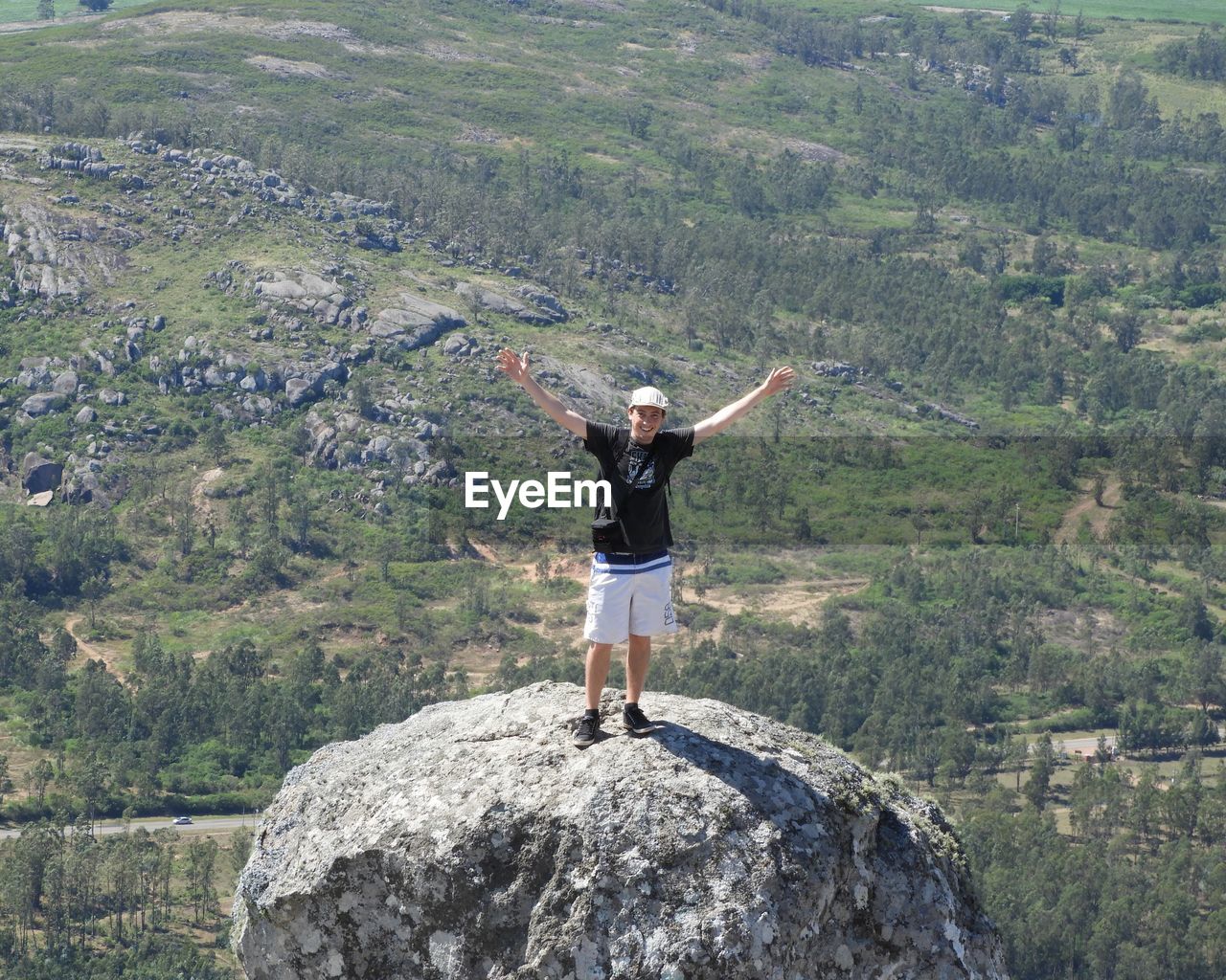 Full length of man standing on rock