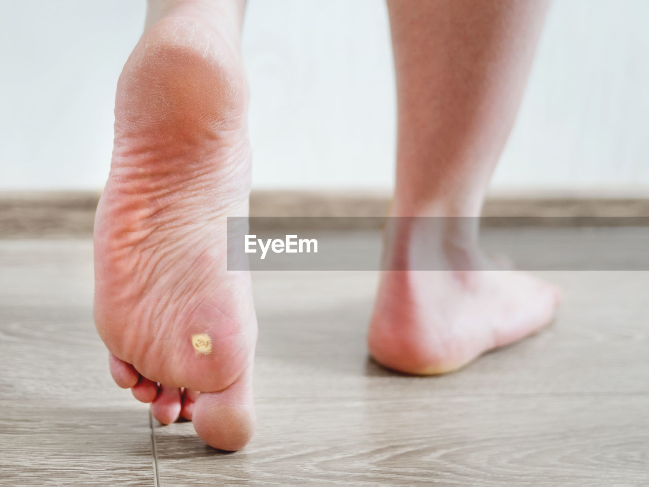 human leg, low section, one person, barefoot, limb, adult, toe, human foot, heel, footwear, human limb, indoors, close-up, flooring, pink, women, arm, shoe, lifestyles, hand, standing, day