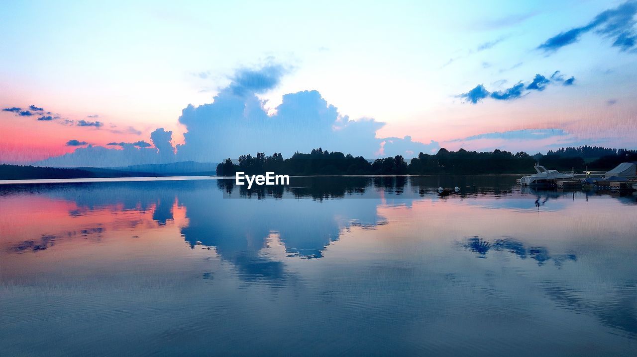 Scenic view of lake against sky during sunset