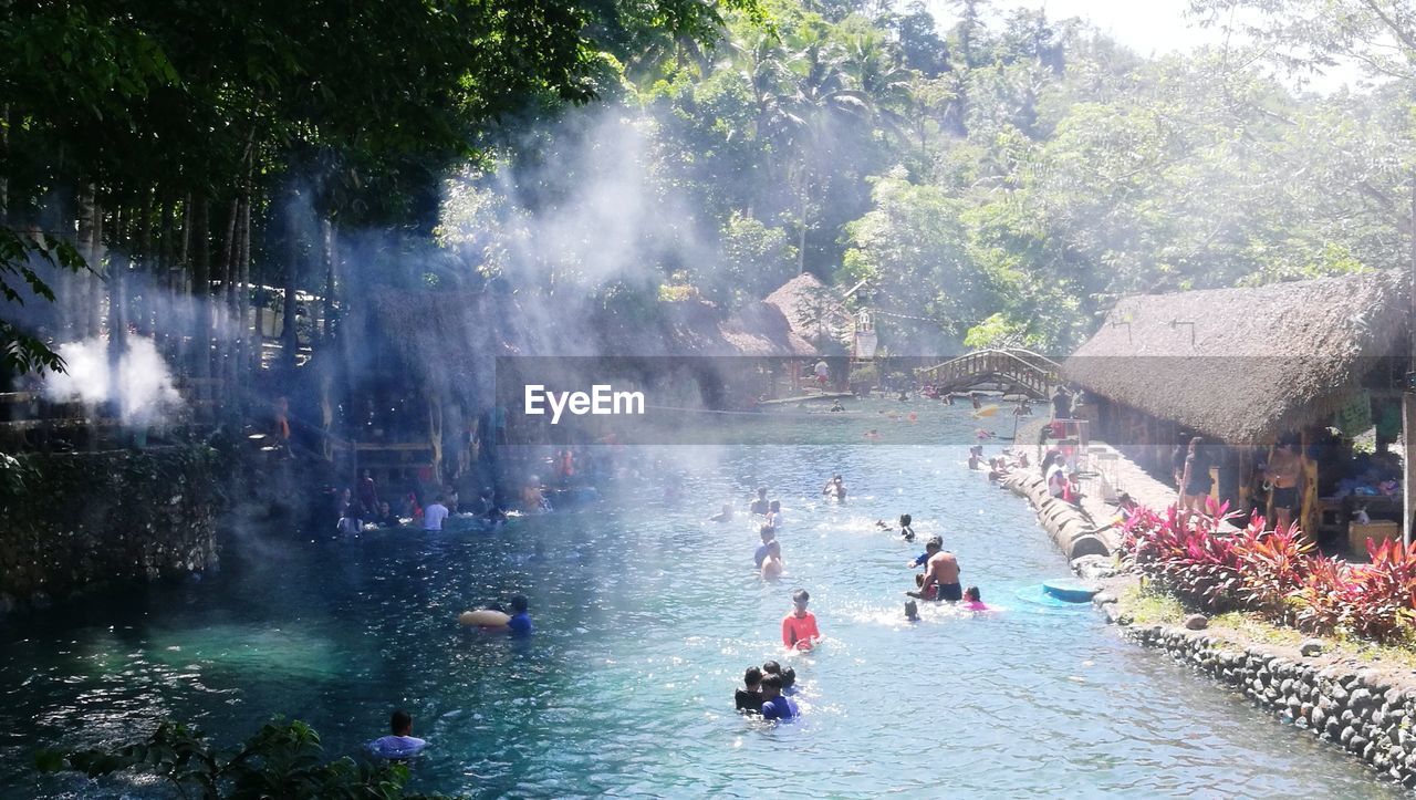 PEOPLE ENJOYING AT WATER