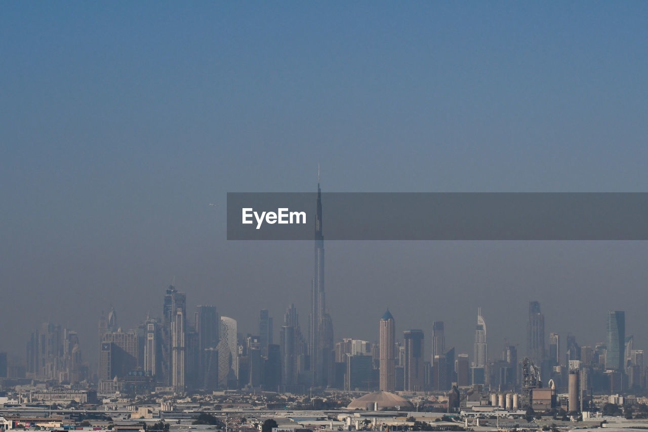 PANORAMIC VIEW OF BUILDINGS AGAINST SKY