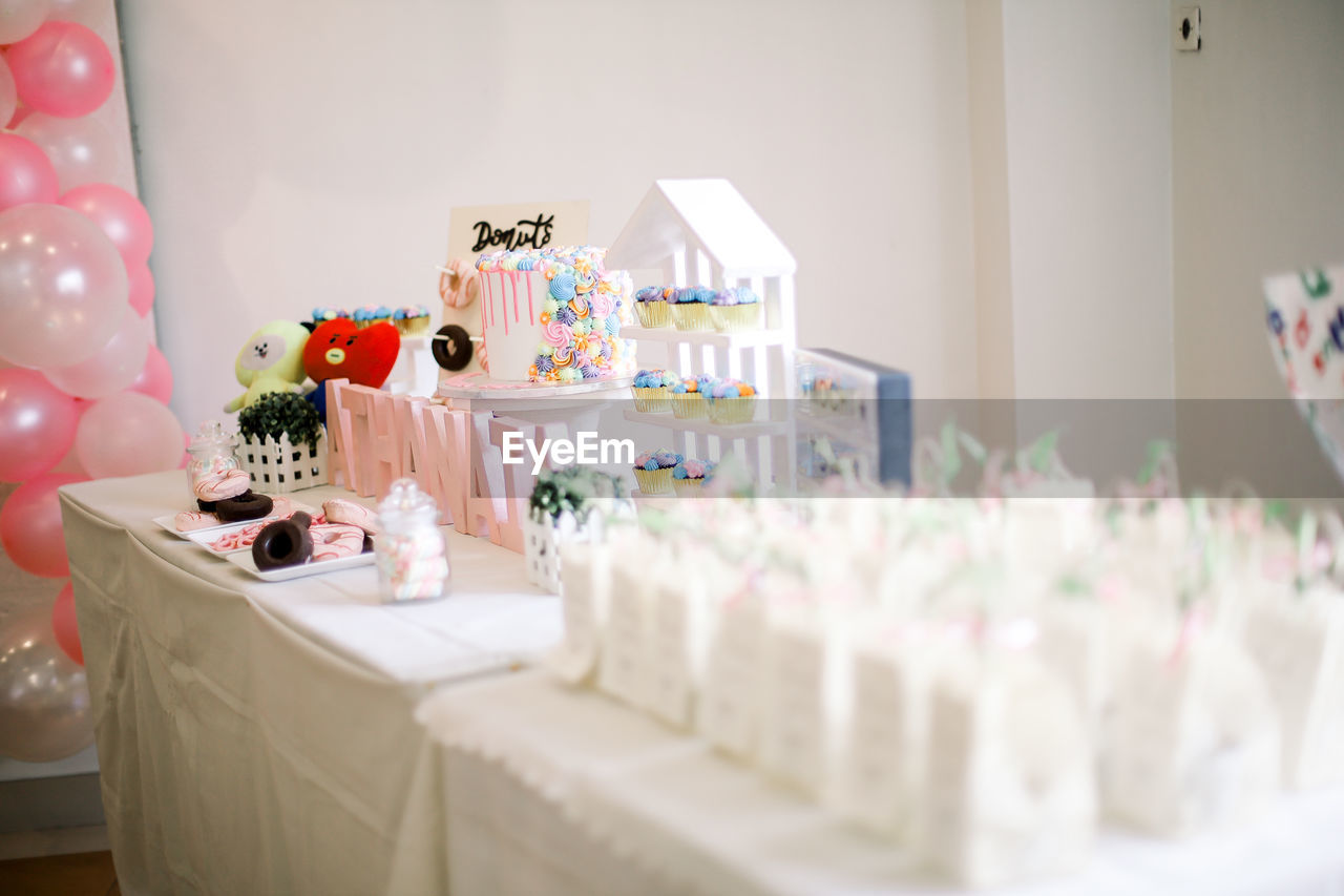 VIEW OF CANDLES ON GLASS TABLE