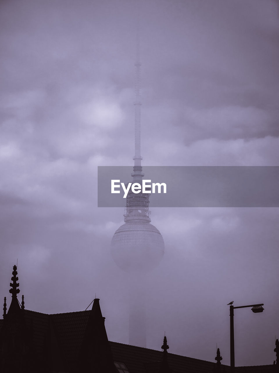 LOW ANGLE VIEW OF COMMUNICATIONS TOWER AGAINST SKY