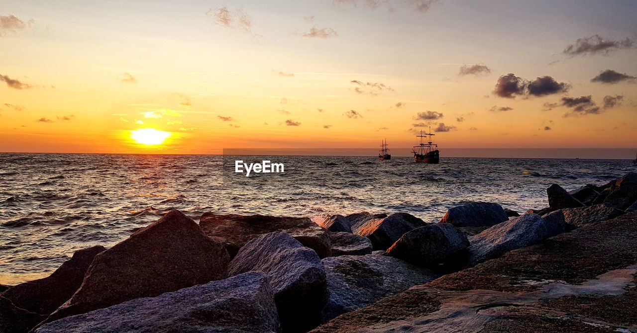 Scenic view of sea against sky during sunset