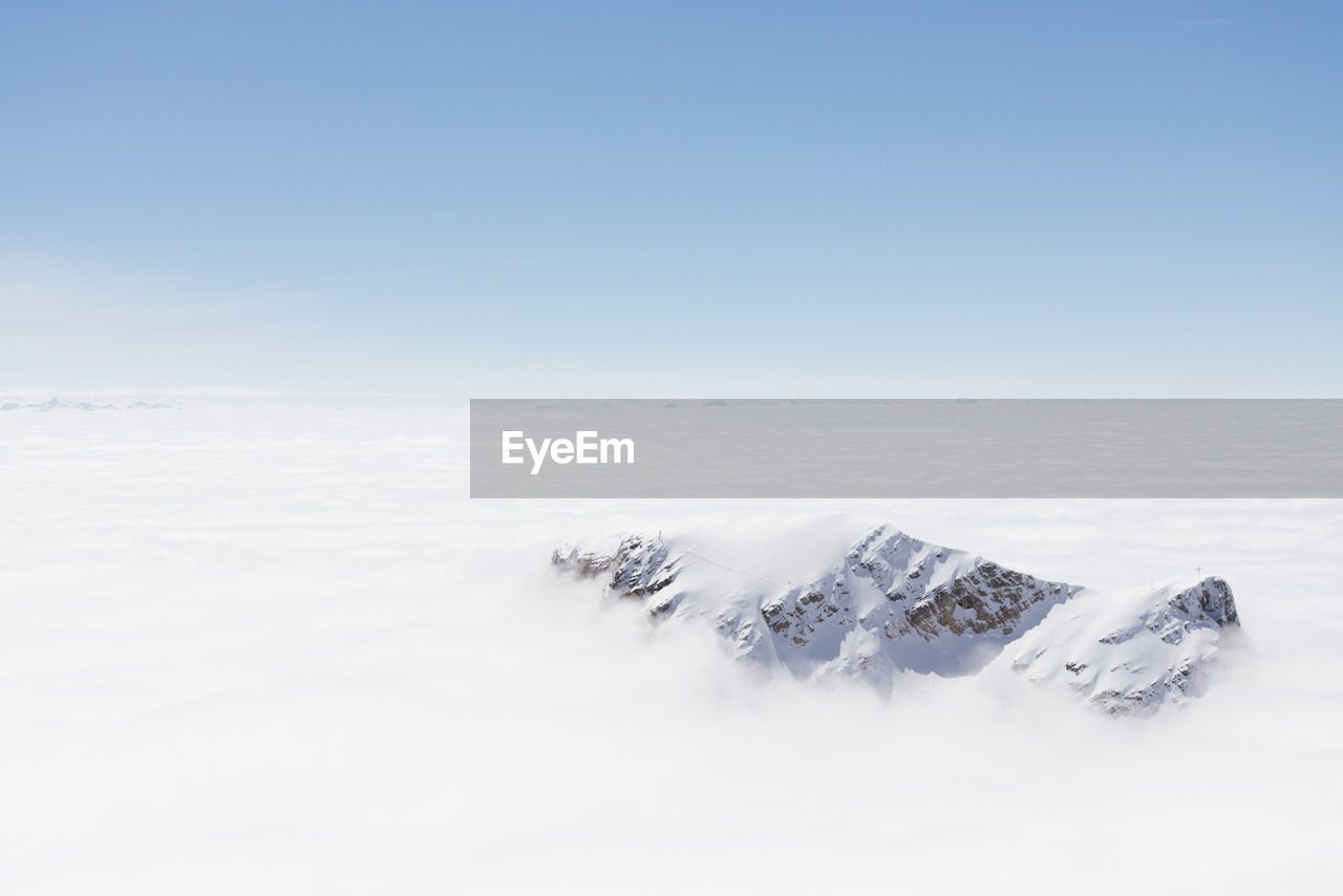 Aerial view part of the peak at range of zugspitze alps over the cloud.