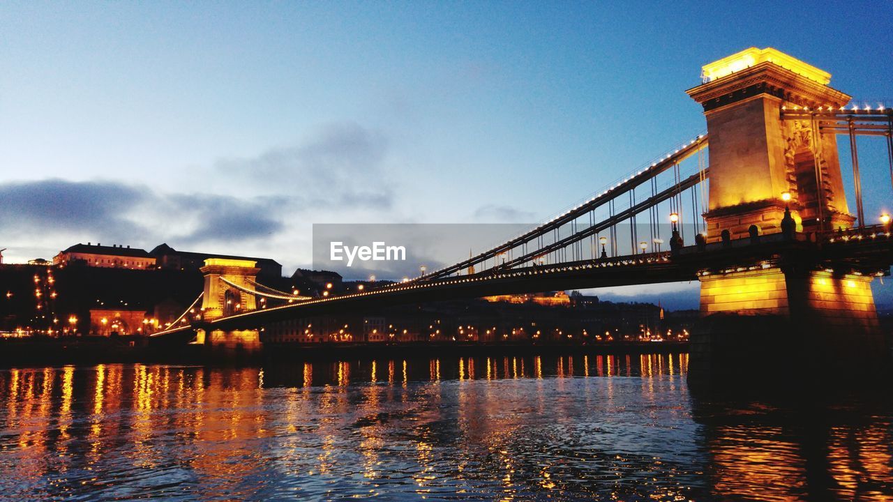 Low angle view of illuminated chain bridge over danube river