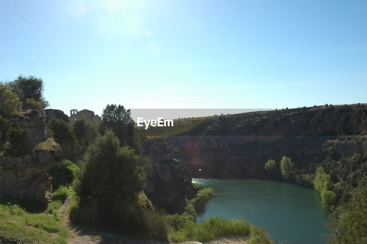SCENIC VIEW OF RIVER AGAINST CLEAR SKY
