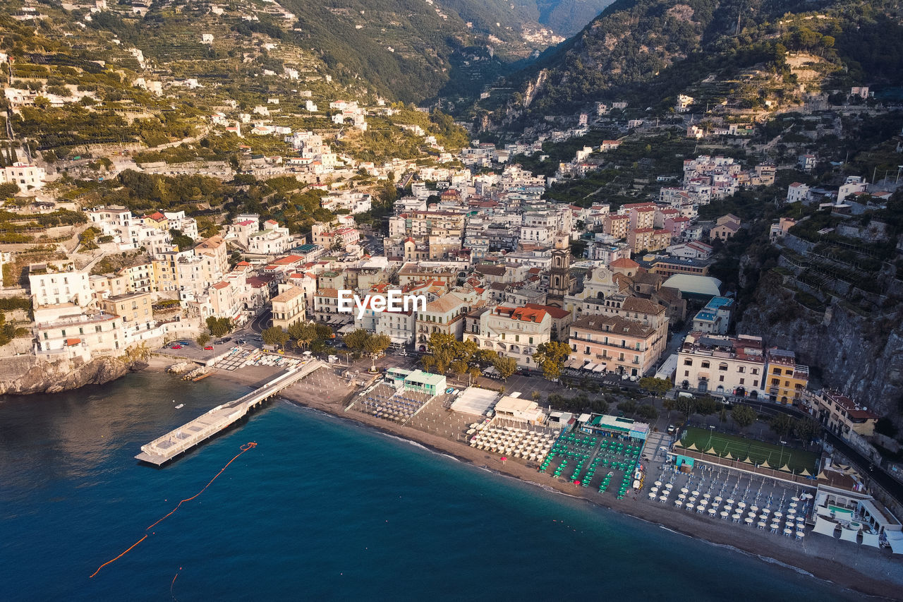 High angle view of townscape by sea