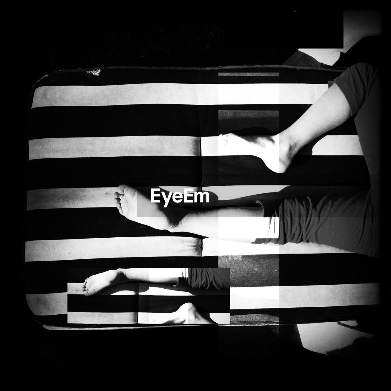 High angle view of person relaxing on bed at home