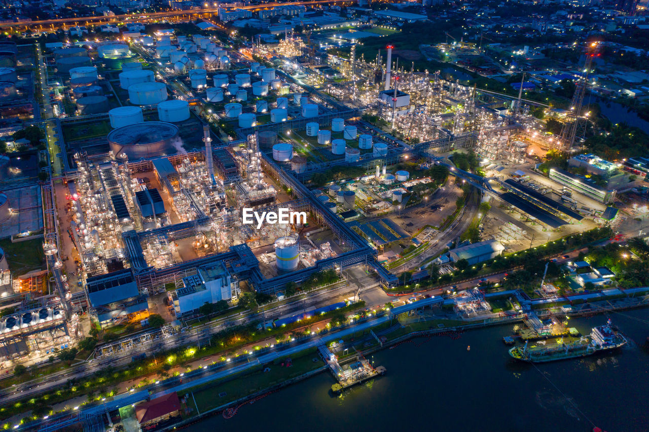High angle view of city lit up at night