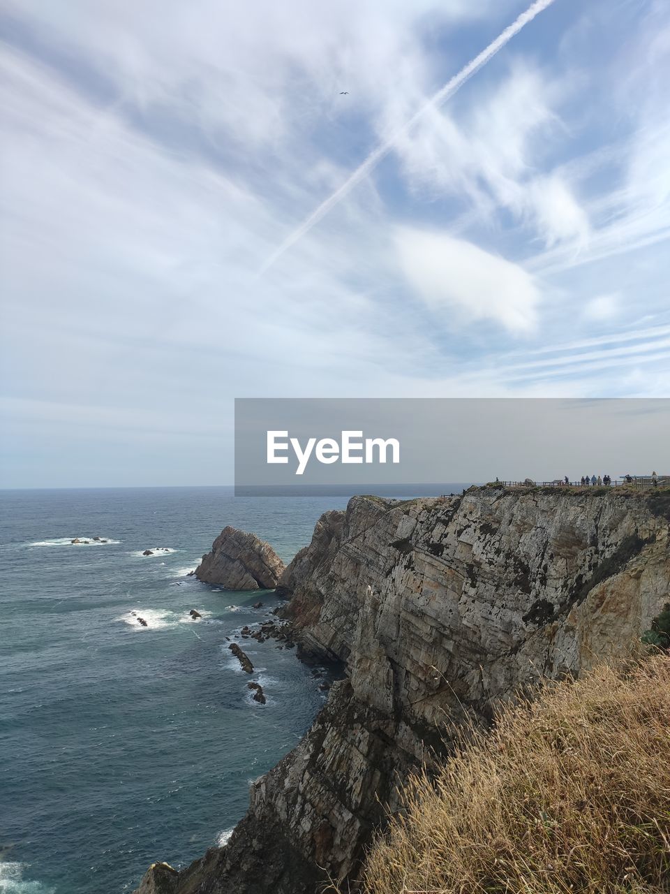 water, nature, blue, cloud, day, sky, beauty in nature, scenics - nature, sea, cliff, terrain, reflection, outdoors, rock, no people, mountain, motion, land, ice, sunlight, tranquility, environment, rock formation, travel, non-urban scene, tranquil scene, sports, wave, low angle view