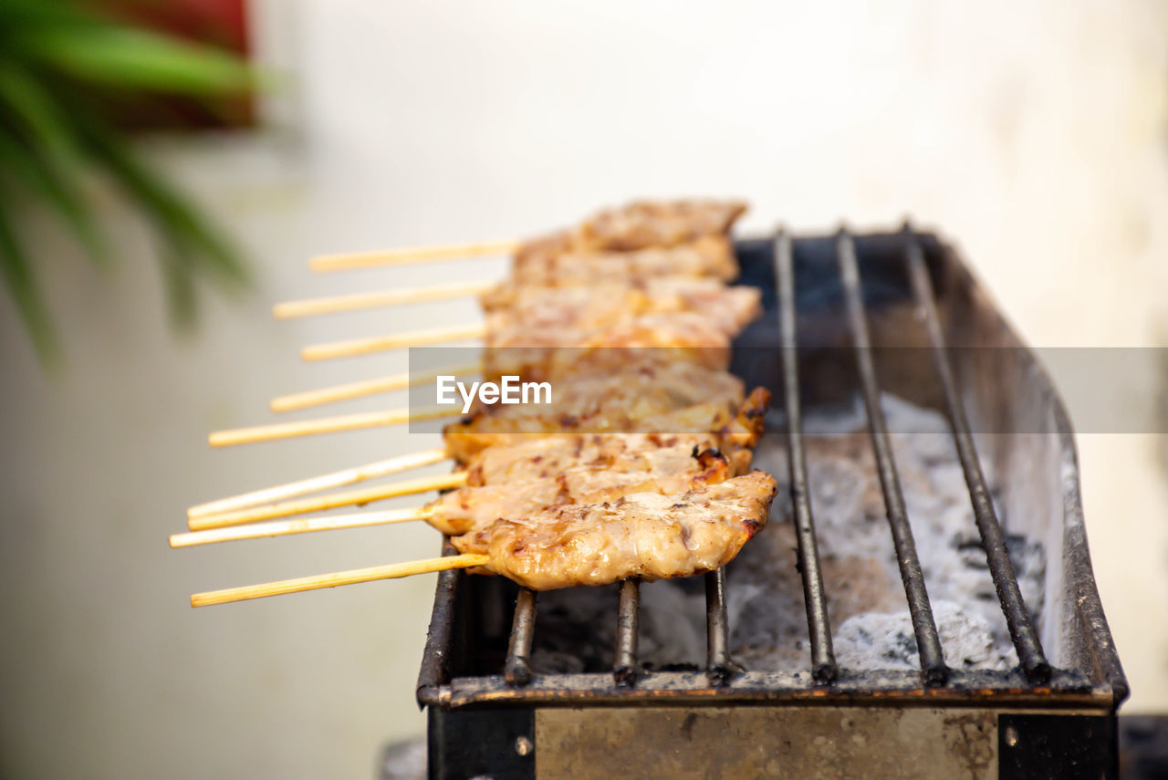 Close-up of meat on barbecue grill