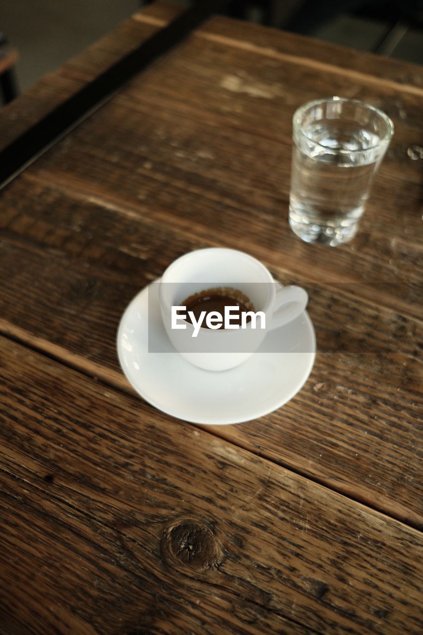 High angle view of coffee cup on table