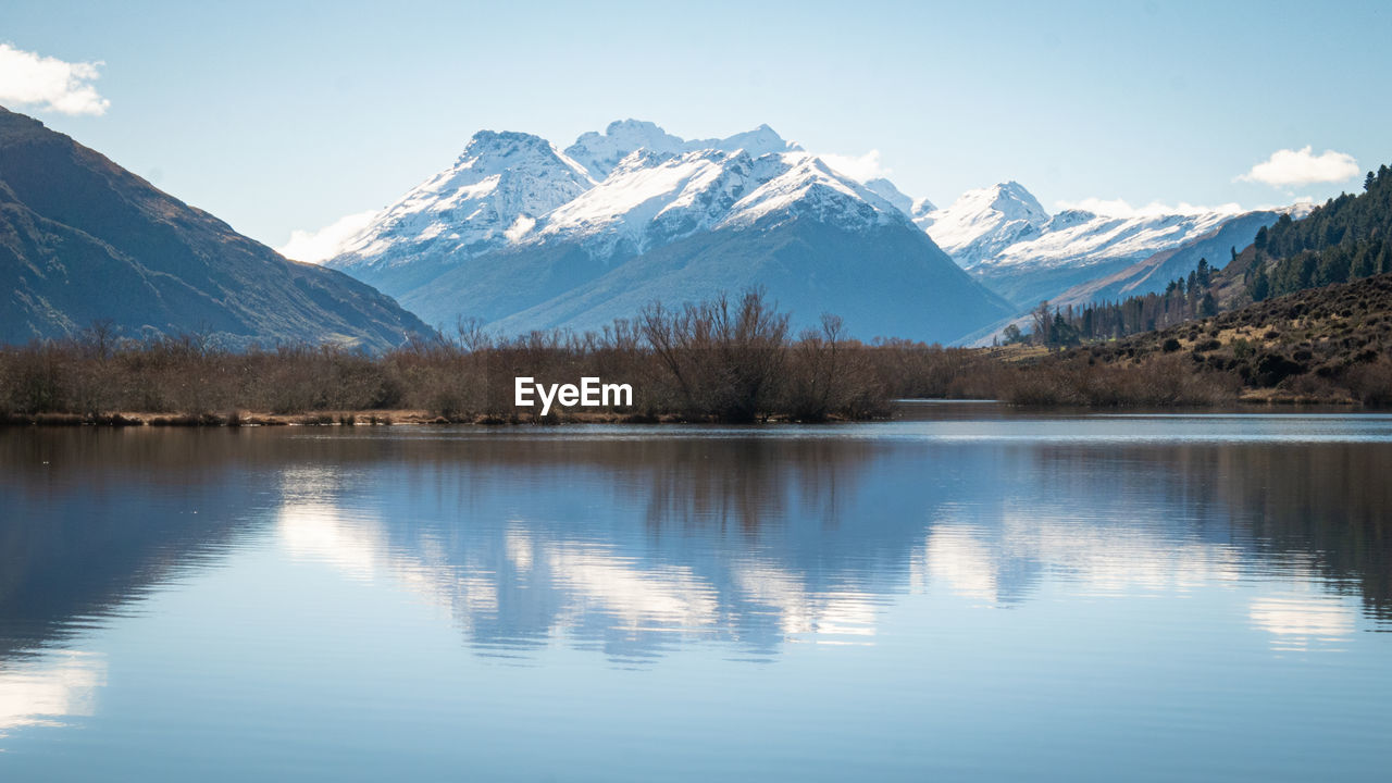 Symetric landscape shot with mountain reflected in lake.shot made in glenorchy, new zealand