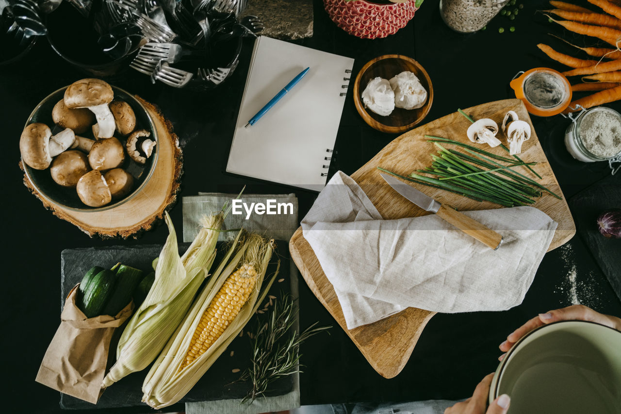 Directly above view of fresh vegetables and diary kept on counter in studio