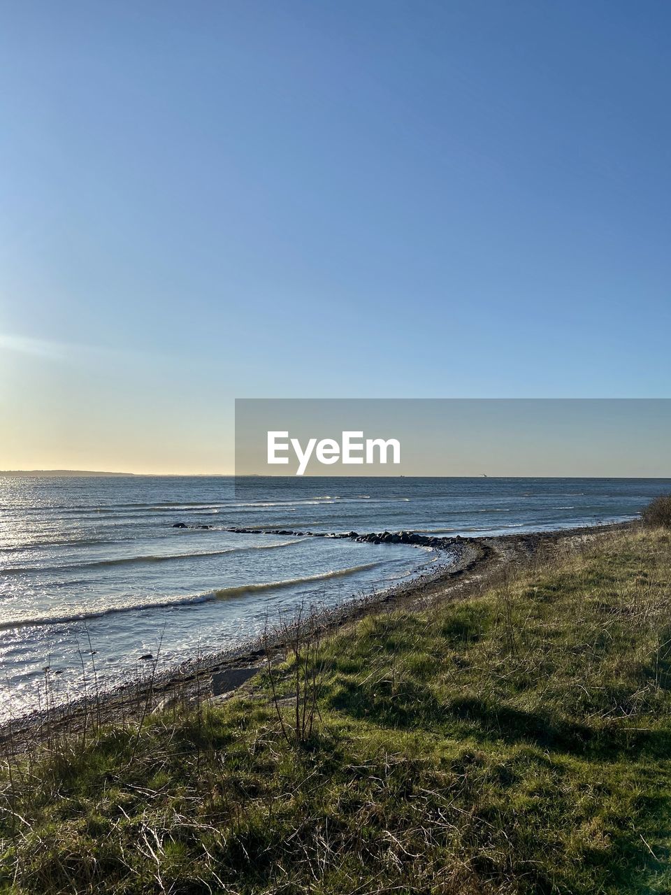 Scenic view of sea against clear sky