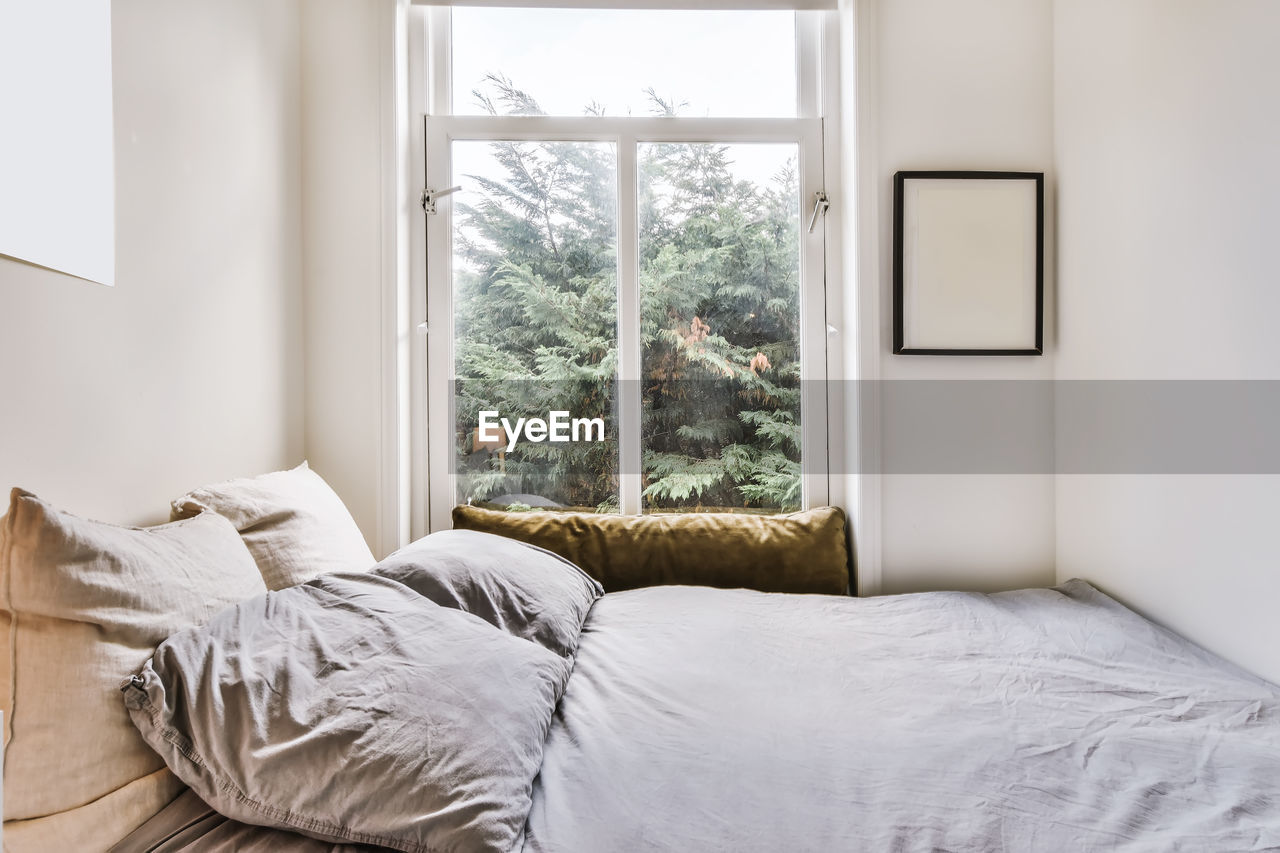 White curtain on bed at home