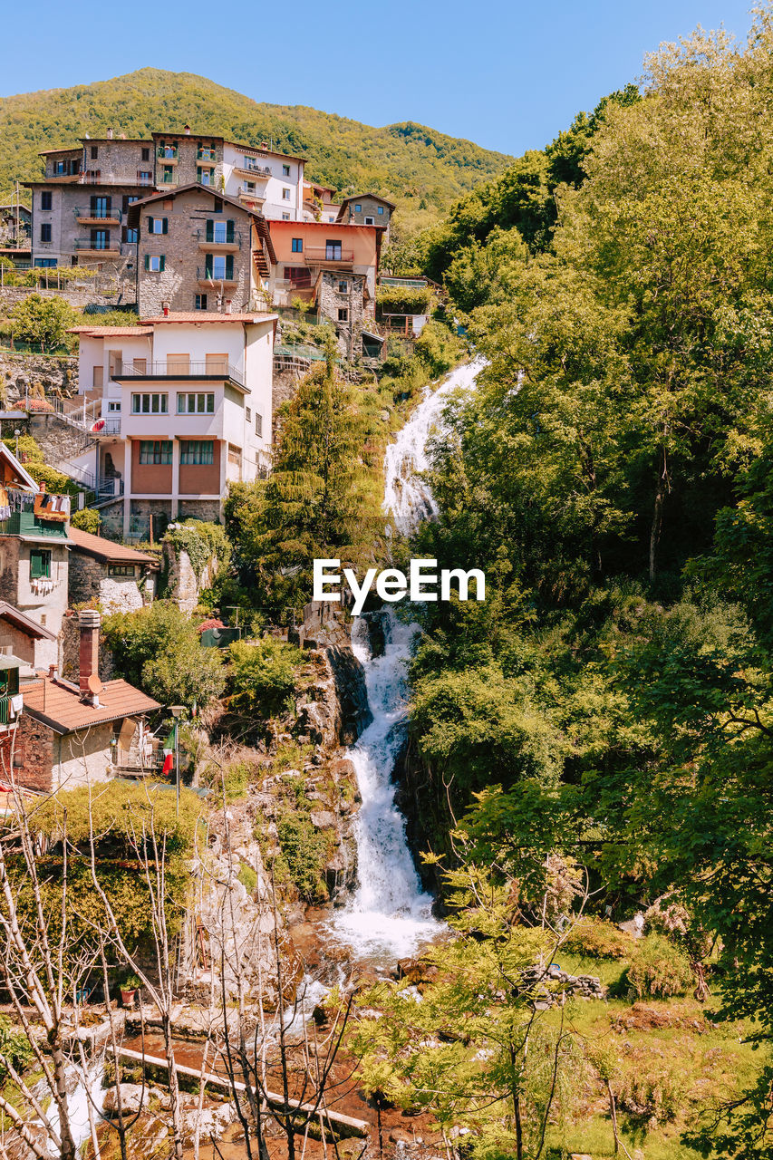 Waterfall on the mountain of village of nesso. orrido of nesso, vertical