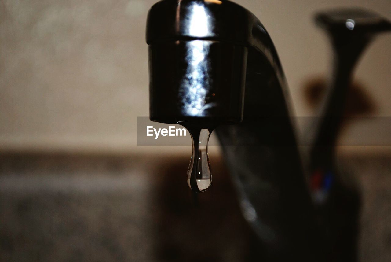 Close-up of water dripping from faucet