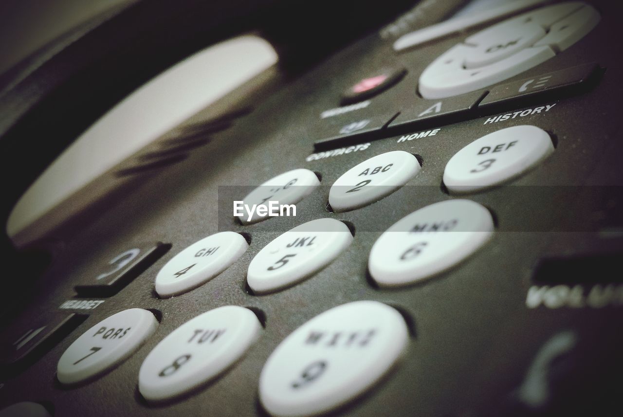 CLOSE-UP OF COMPUTER KEYBOARD ON WALL