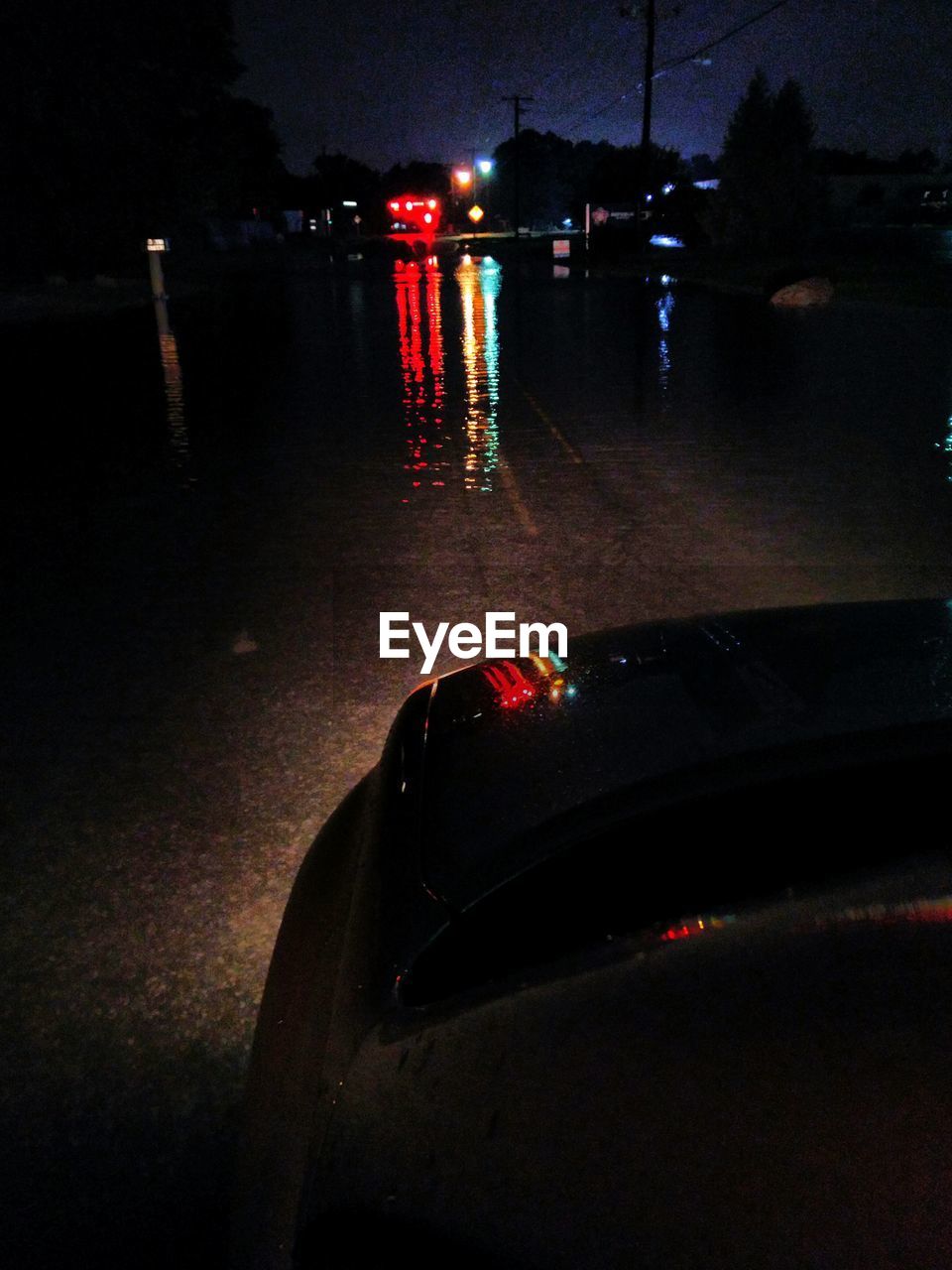 REFLECTION OF ILLUMINATED LIGHTS ON WATER