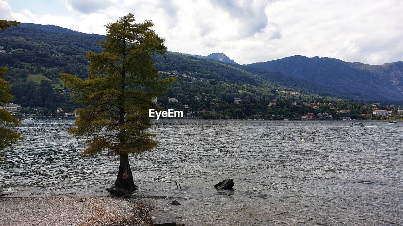 Scenic view of lake and mountains against sky