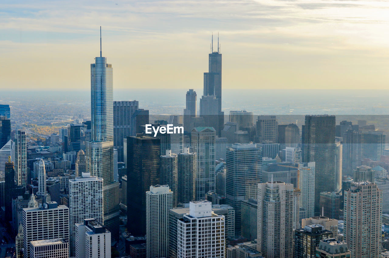 High angle view of cityscape against cloudy sky