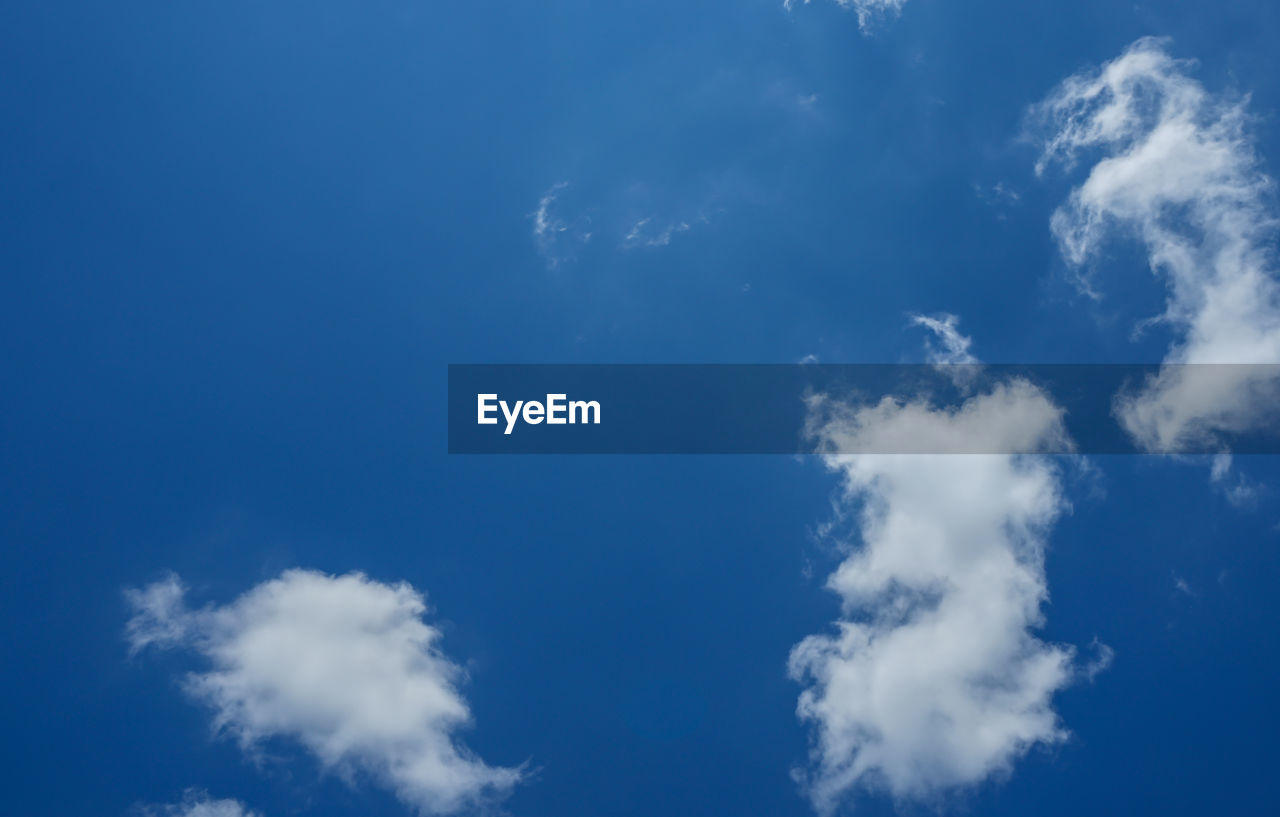 LOW ANGLE VIEW OF CLOUDS IN BLUE SKY