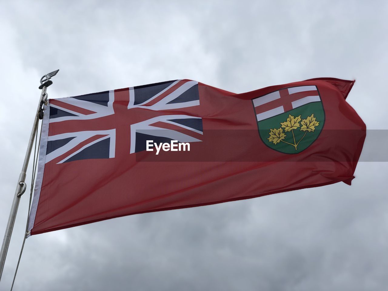 Low angle view of ontario flag against sky