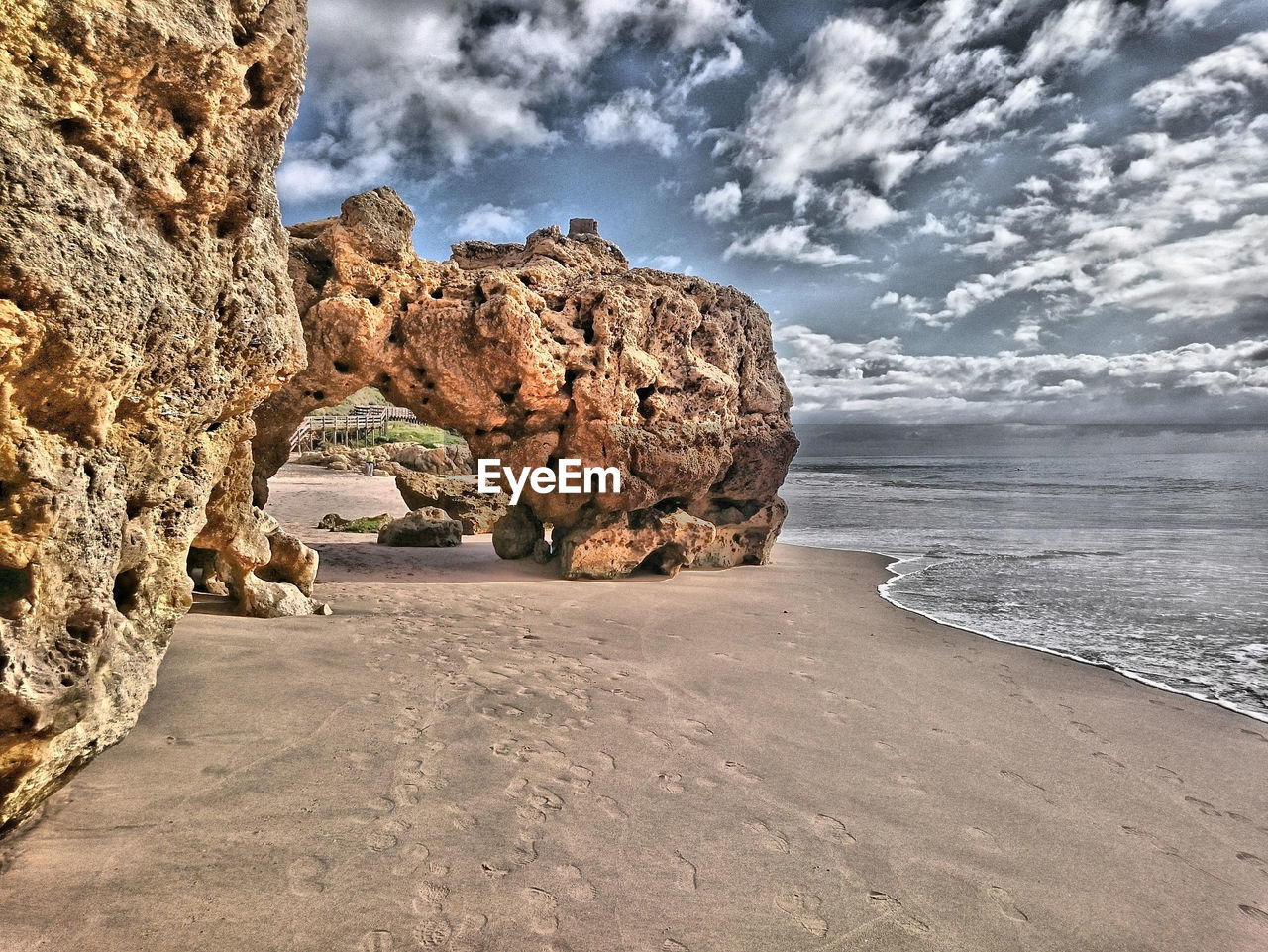 Scenic view of sea against cloudy sky