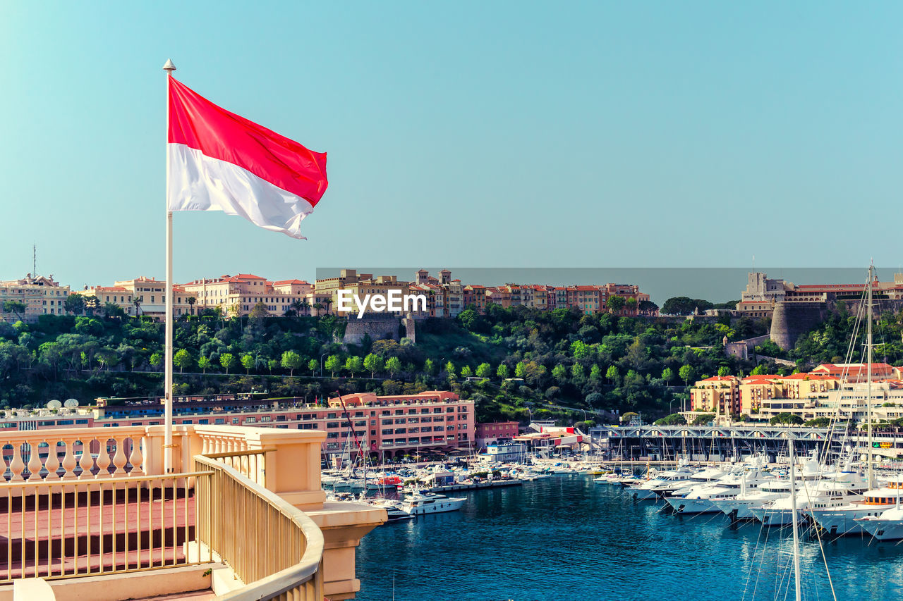 Flag on balcony against clear sky