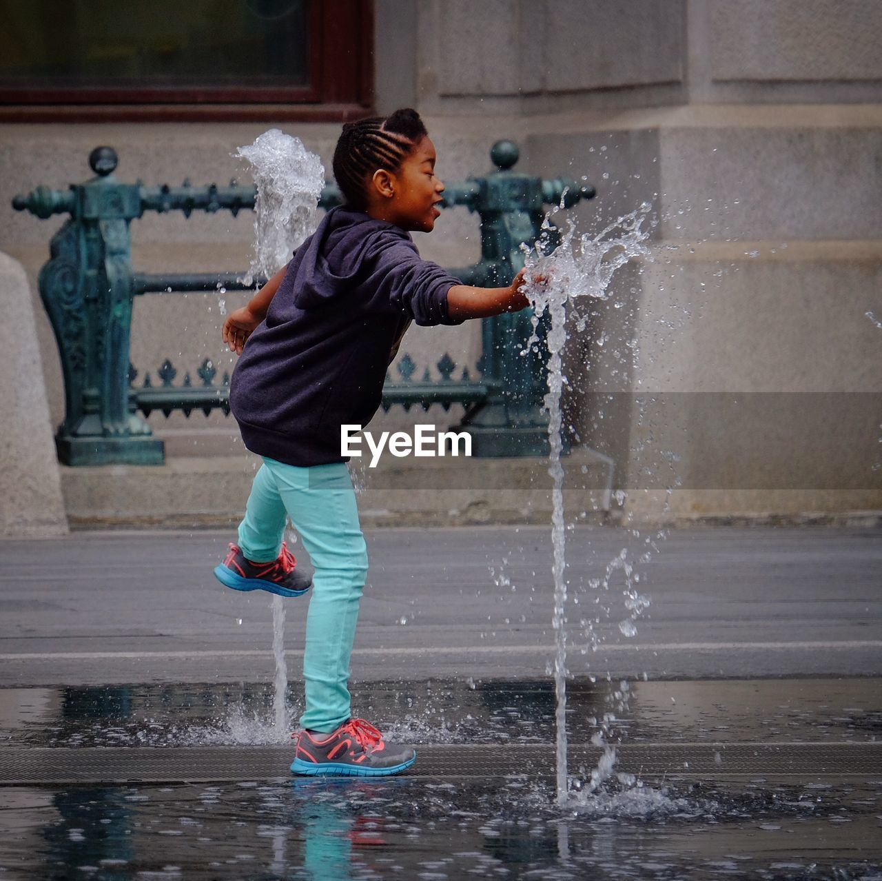 WOMAN STANDING IN WATER