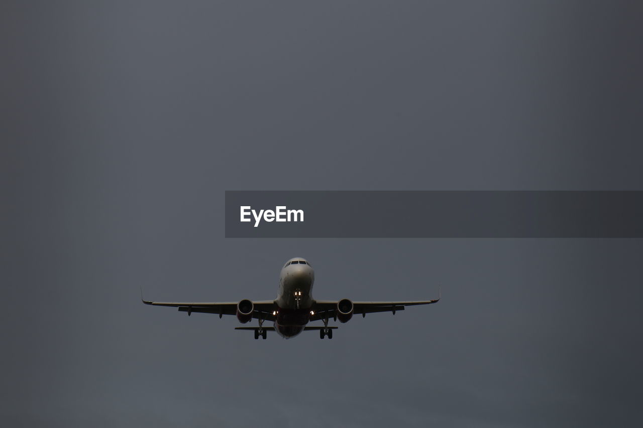 Low angle view of airplane against clear sky