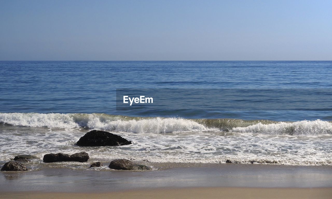 Scenic view of sea against clear sky