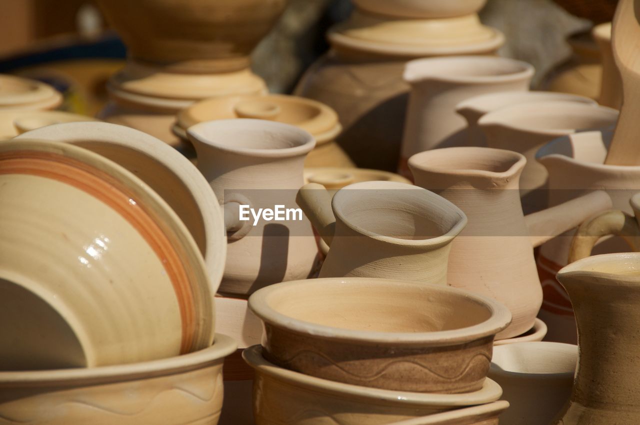 Close-up of ceramic jugs and bowls